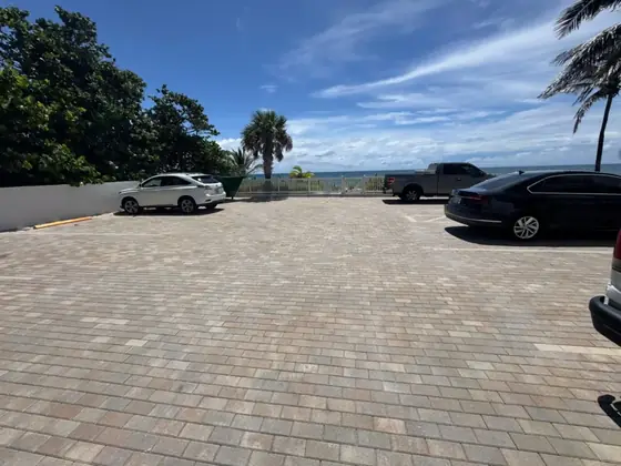 Large paver parking area by the water