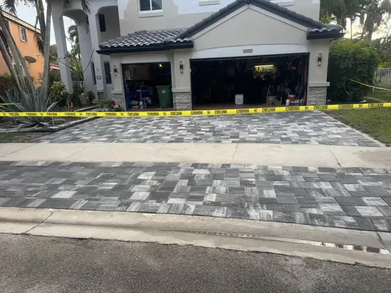 New paver driveway in front of a garage