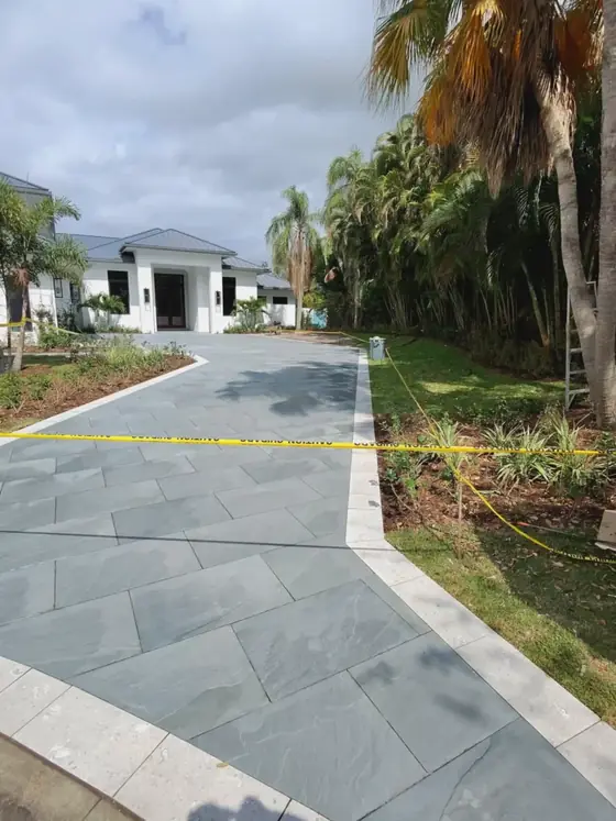 Gray stone slab driveway under construction