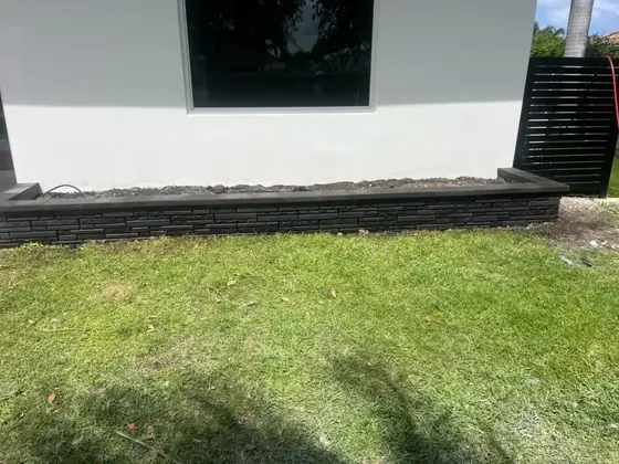 Low retaining wall along a lawn